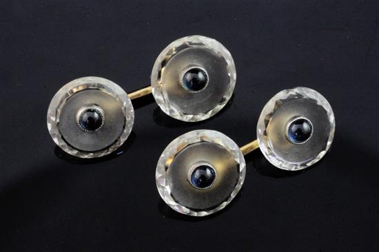 A pair of 14ct gold, rock crystal and cabochon sapphire set disc cufflinks.